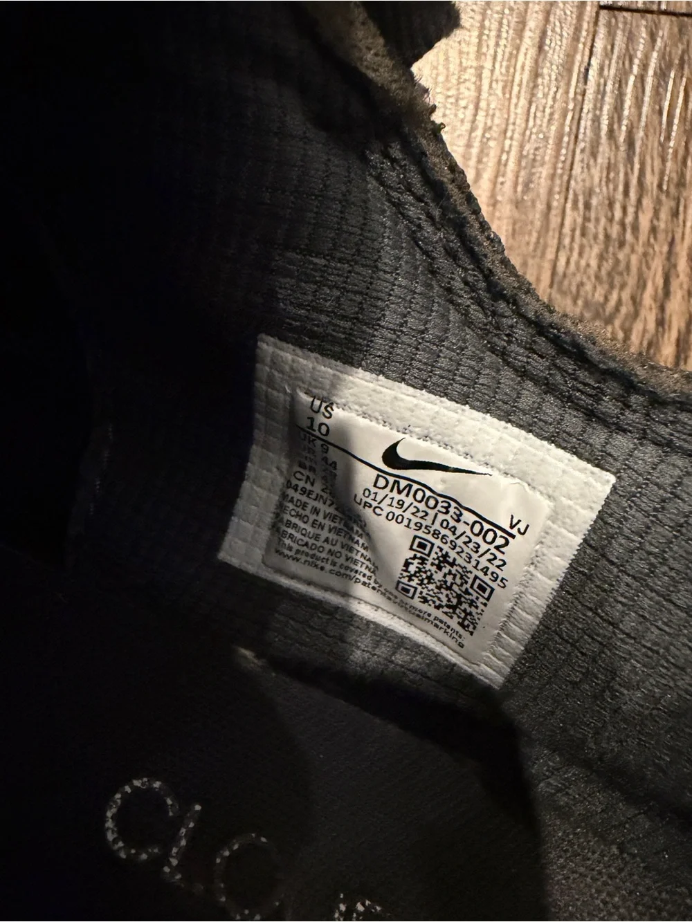 Nike Black Sneaker with White Swoosh and Yellowed Midsole